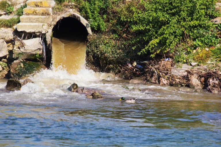industrial pollution from water pipe dumped into river