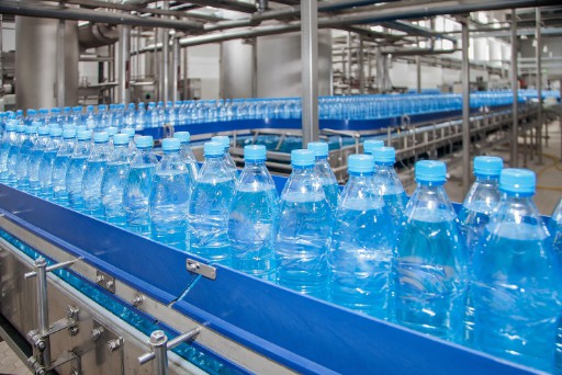 plastic water bottles on assembly line