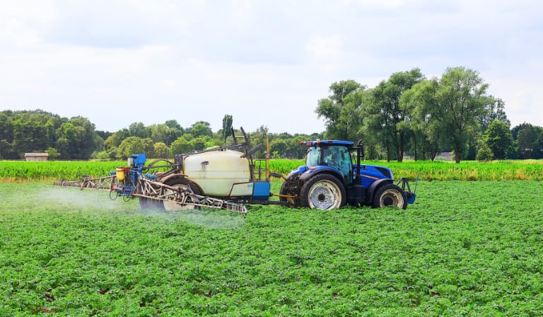 tractor spraying crops
